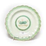 An 18th century Worcester lobed plate, decorated with gilt and French green enamel with a saw