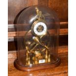 A brass great wheel single fusee mantle timepiece, 20th century, raised upon a wooden base and