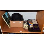 A selection of collectors items including: three Ronson lighters, three military cap badges: a cased