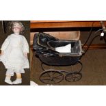 Early 20th century dolls pram with leatherette hood and a large Simon & Halbig bisque socket head