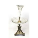 A Victorian silver plate and glass table centrepiece, on triangular base and with openwork cast
