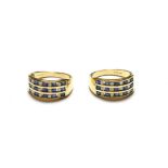 A pair of 9 carat gold sapphire and diamond rings, formed of three rows of five calibré cut