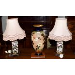 A Royal Doulton stoneware floral decorated vase, 44.5cm high, together with a pair of floral