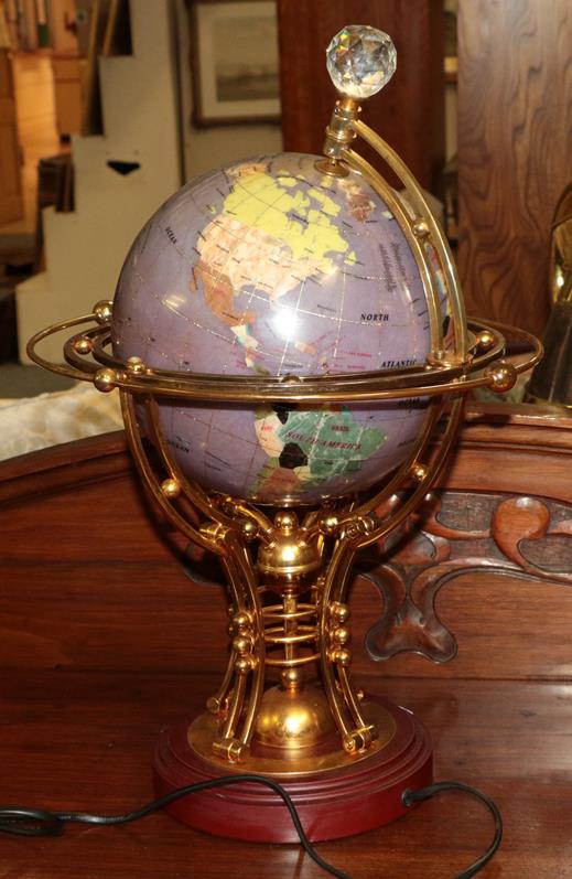 An Osborne & Allen illuminated and rotary globe, with elaborate gilt metal frame, on plinth base.