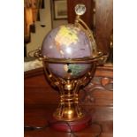 An Osborne & Allen illuminated and rotary globe, with elaborate gilt metal frame, on plinth base.