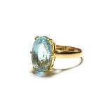 A blue topaz ring, stamped '9K', finger size Q. Gross weight 5.3 grams.