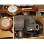 A selection of clocks, including four mantel clocks, oak cased aneroid barometer, carved pedestal