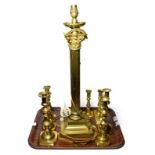 A brass Corinthian column table lamp, together with some brass candle sticks (qty)