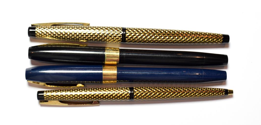 Three Sheaffer fountain pens and a ballpoint pen