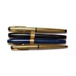 Three Sheaffer fountain pens and a ballpoint pen