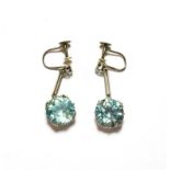 This Lot Is Being Sold on Behalf of a Charity: a pair of blue zircon and diamond drop earrings, an