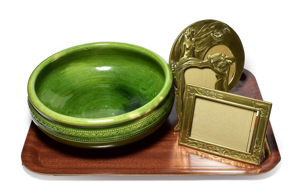 Three Art Nouveau style frames and a Clarence pottery Stockton-on-Tees green glazed bowl