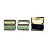 A set of three dress studs, two hallmarked for 9 carat gold and one stamped '18CT', cased; a set