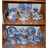 A quantity of various blue and white willow pattern ceramics, including teapots, biscuit barrel,