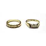 A diamond five stone ring, stamped '9K', finger size L1/2; and a diamond three stone ring,