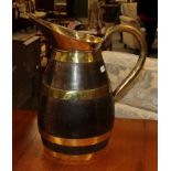 A wood and brass ewer