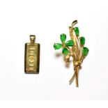 A green stone floral spray brooch, stamped '14K', length 5.5cm; and a silver ingot . Brooch - 6.1