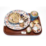 Five Royal Crown Derby pieces comprising a miniature tankard, small dish, pepper, a saucer and a