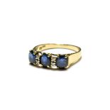 A sapphire and diamond ring, stamped '585' and '14K', finger size Q1/2. Gross weight 3.0 grams.