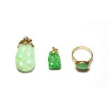 A jade ring, stamped '14K', finger size Q1/2; and two jade type pendants . Ring - 4.0 grams.