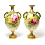 A pair of Royal Worcester twin-handled rose decorated vases, shape number 2304. One monogramed A.S.,