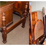 An Edwardian mahogany single bed with reeded columns and acorn finials, with a caned headboard