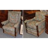 A pair of early 20th century carved oak armchairs, later recovered in floral fabric
