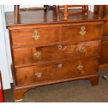 An early 19th century mahogany three height chest of drawers, 116cm by 62cm by 98cm . Back left foot