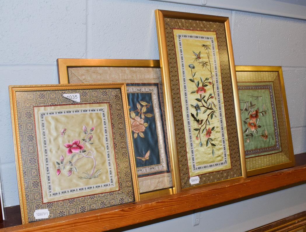 Four Oriental embroidered silk panels (framed)