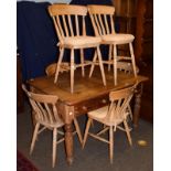 A pine farmhouse kitchen table, 121cm by 90cm by 77cm, together with a set of six matching chairs (