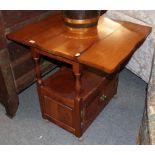 A modern oak occasional table, the rectangular top with drop leaves above a shelf section over a