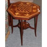 A late Victorian parquetry decorated occasional table with foliate and bird decoration on tapering