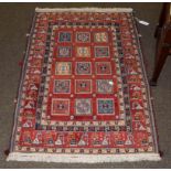 Unusual piled and Soumakh rug, probably Kashgai, the terracotta fields with three columns of