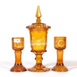 A Bohemian Amber Overlay Clear Glass Goblet Vase and Cover, mid 19th century, the panelled bowl