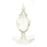 An Apothecary's Glass Display Jar and Cover, late 19th/early 20th century, of ovoid form, cut with a