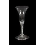 A Wine Glass, circa 1760, the bell shaped bowl on an air twist stem and folded foot, 20cm high. No