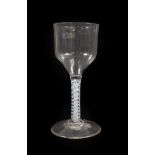 A Glass Goblet, circa 1750, the ogee bowl on an opaque twist stem and circular foot, 21cm high. Free