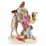 A Royal Dux Porcelain Figure Group, 1920/30, modelled as an Arab riding a camel, an attendant at one