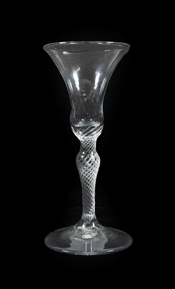 A Wine Glass, circa 1760, the bell shaped bowl on an air twist baluster stem, 17.5cm high. No