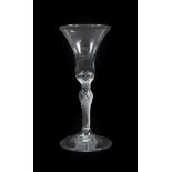 A Wine Glass, circa 1760, the bell shaped bowl on an air twist baluster stem, 17.5cm high. No