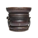 An Iron Bound Turned Lignum Vitae Mortar, late 17th/early 18th century, of baluster form with ring