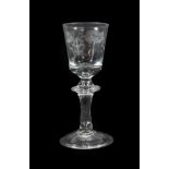 A Hessen Wine Glass, mid 18th century, the rounded bucket bowl engraved with foliage on a knopped