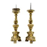 A Pair of Italian Giltwood and Gesso Pricket Candlesticks, 17th century, of leaf sheathed baluster