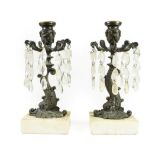A Pair of Bronze Lustre Candlesticks, 19th century, with urn shaped sconces and scroll branches hung