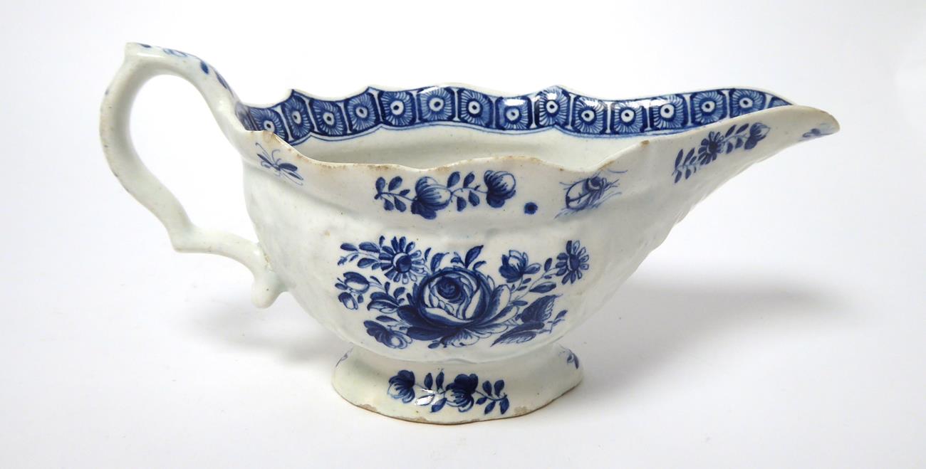 A Bow Porcelain Sauceboat, circa 1770, printed in underglaze blue with stylised foliage, 20cm - Image 19 of 19