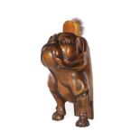 A French Walnut Brush Stand, early 20th century, modelled as a bulldog with glass eyes, 25cm high;