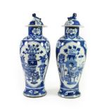 A Pair of Chinese Porcelain Baluster Vases and Covers, Qianlong reign mark but circa 1900, with