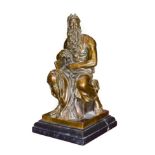 After Michelangelo: A Bronze Figure of Moses, seated, tablets under one arm, on a rectangular base