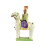 A Chinese Porcelain Figure of a Sage, Qing Dynasty, possibly 18th century, on horseback, on a