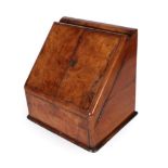 A Victorian Walnut Stationery Box, the hinged top over two sloping hinged doors enclosing a fitted